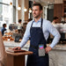 Café worker wearing an Agoz waist belt holster with Stripe Reader S700 and S710 for mobile payment workflows