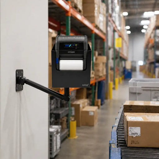 Citizen mobile printer swing arm mount installed on a warehouse wall near a conveyor station