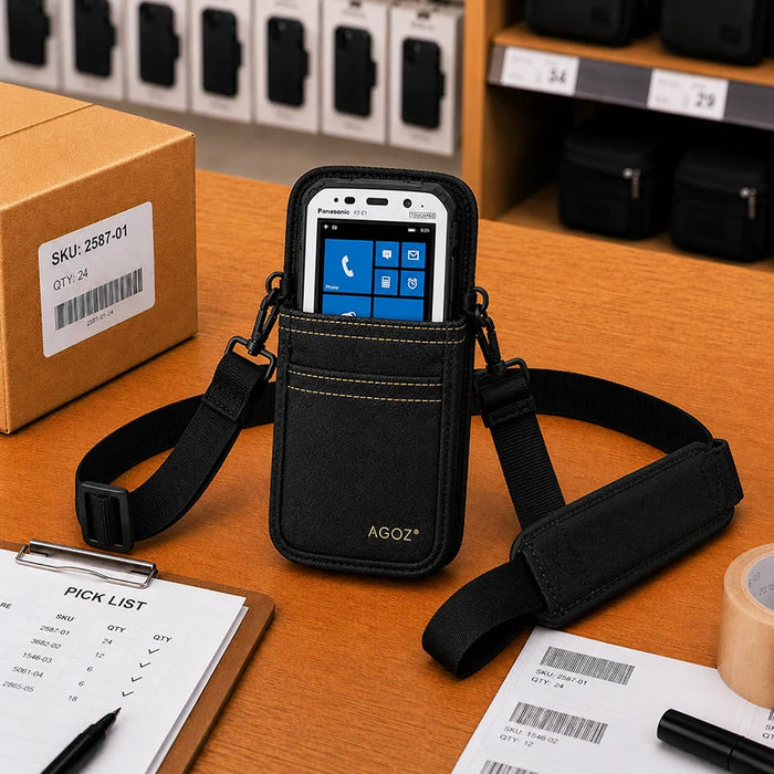 Black Panasonic Toughbook shoulder sling holster with device displayed in pouch on a retail packing workstation.
