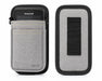 A honeywell handheld scanner in a gray belt waist case on a white background