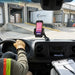 Cipherlab mobile scanner mounted on a delivery vehicle dashboard using an AgozTech cradle holder at a warehouse loading dock.