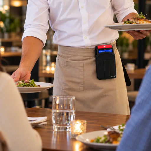Restaurant server carrying a plated meal with an iMin Swift POS terminal secured in an Agoz black belt clip holster for hands-free service.