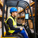 Warehouse forklift operator using the AGOZ iPad Tablet Mount Holder for Forklifts to keep a tablet visible during operation.
